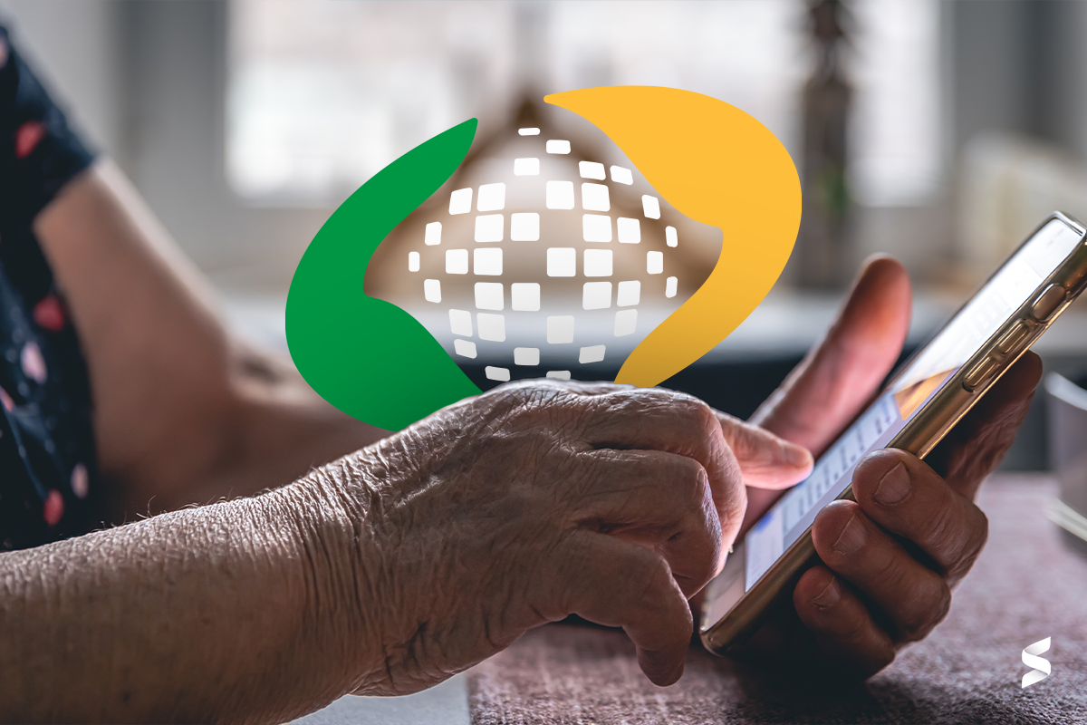 Imagem de uma mão segurando um celular com o logo do INSS, representando o acesso à segunda parcela do 13º salário do INSS.