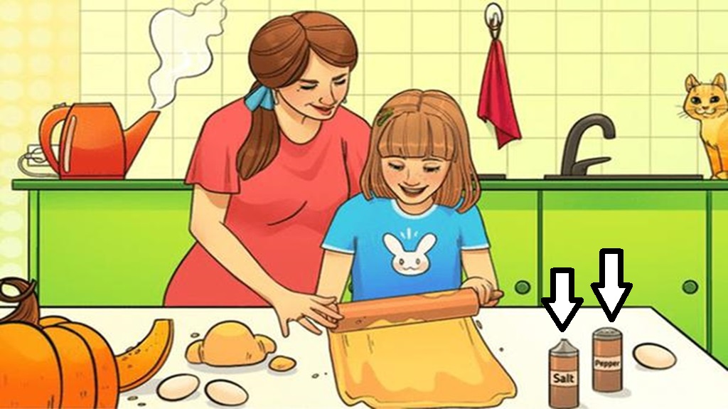 Solução do desafio visual com uma ilustração de mãe e filha felizes preparando massa na cozinha, com ingredientes sobre a mesa e um gato ao fundo.