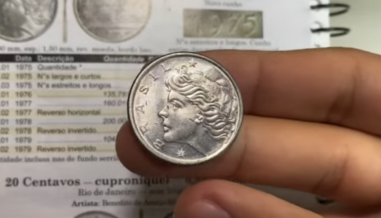 Moeda de 50 centavos de Cruzeiro de 1975, mostrando o rosto de uma mulher e detalhes do valor e ano