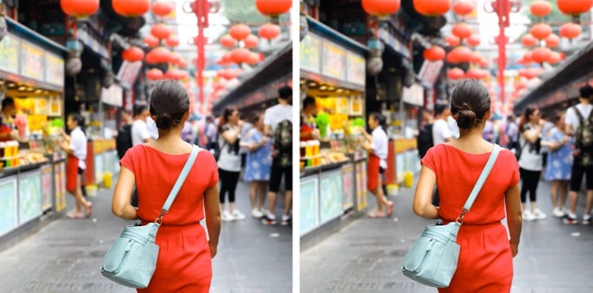 Teste visual com uma mulher de vestido vermelho e bolsa azul claro, caminhando por mercado de rua com lanternas vermelhas suspensas.