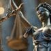 Representação simbólica da Justiça, com a deusa segurando a balança, ícone do equilíbrio e da imparcialidade no Direito.