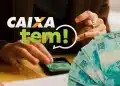 Aplicativo Caixa Tem aberto no celular com notas de 100 reais ao lado, relacionado ao pagamento de R$ 200.