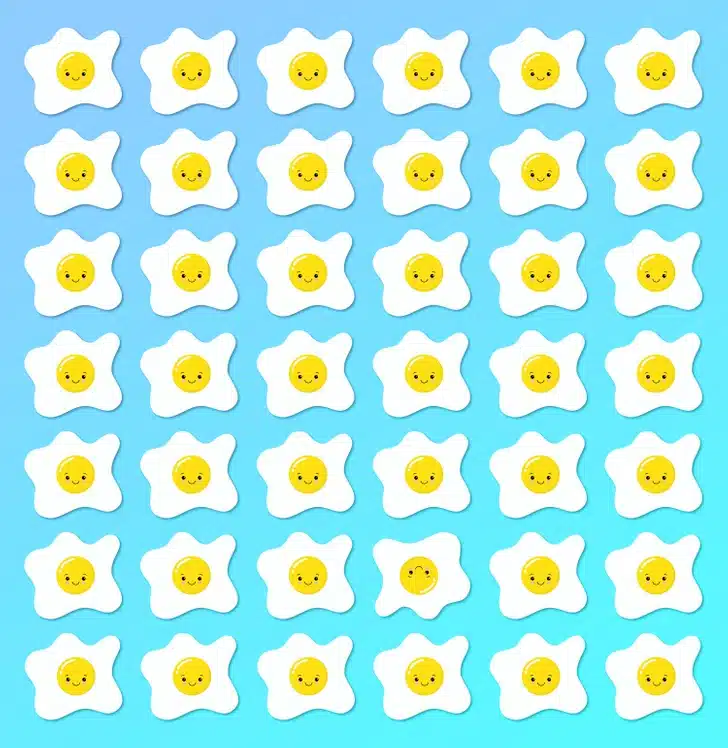 Ache o ovo frito diferente entre os ovos estrelados com expressões felizes. Desafio visual com um padrão de ovos estrelados desenhados com rostos amarelos sorridentes em fundo azul.