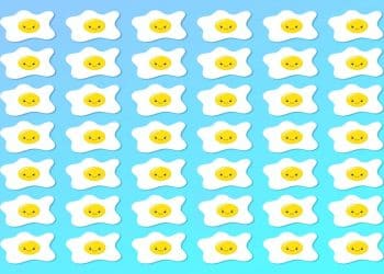 Desafio visual com um padrão de ovos estrelados desenhados com rostos amarelos sorridentes em fundo azul.