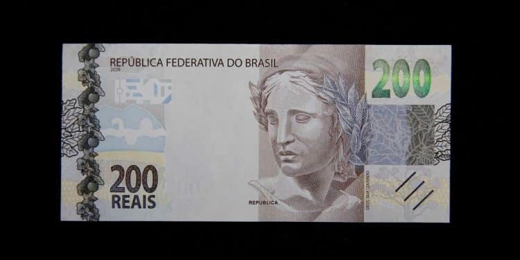 Visão frontal de uma cédula de 200 reais da República Federativa do Brasil, destacando a efígie da República e o número de série que pode conter o padrão radar.