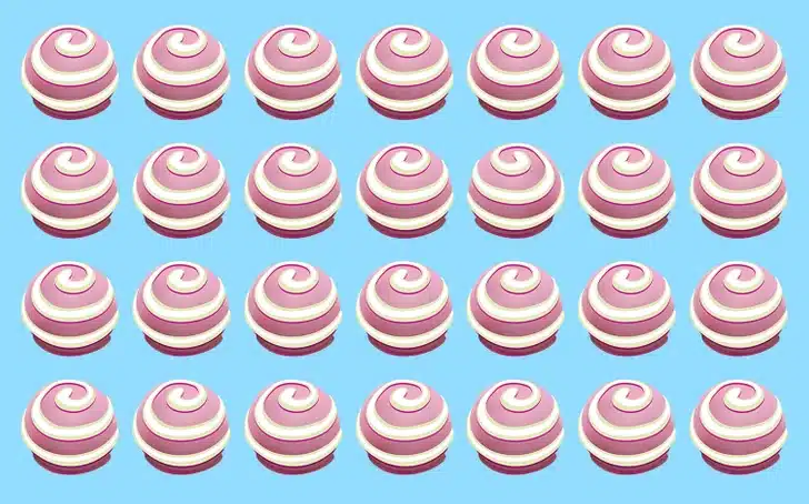 Teste visual com vinte e oito doces redondos rosa e branco em espiral sobre fundo azul