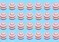 Teste visual com vinte e oito doces redondos rosa e branco em espiral sobre fundo azul