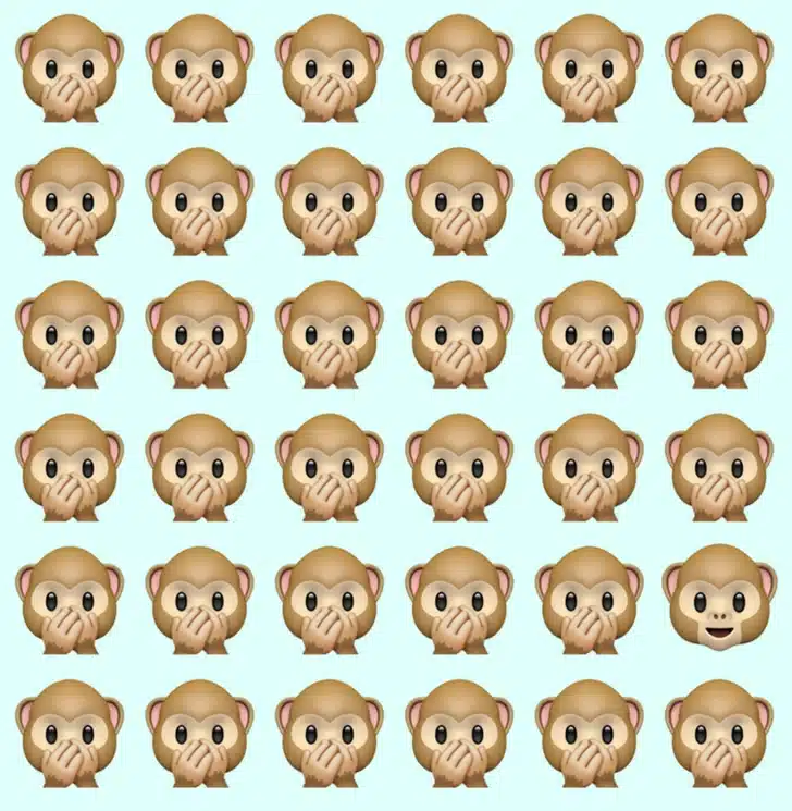Desafio visual com diversos emojis de macaquinho alinhados; um deles sorrindo de boca aberta