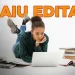 Jovem estudando no computador enquanto lê livros, anunciando novo concurso com 80 vagas e salários de até R$ 9,6 mil.