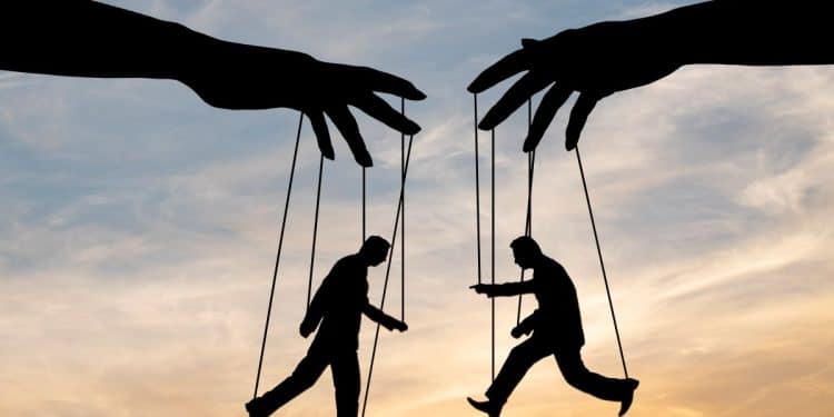 Ilustração conceitual de um manipulador controlando uma marionete, com silhuetas de figuras humanas sendo controladas por mãos grandes e poderosas ao fundo, simbolizando controle e manipulação.