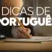 Pessoa escrevendo em caderno com o título 'DICAS DE PORTUGUÊS'.
