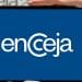 Mão segurando celular exibindo logotipo do Encceja com cartão de prova ao fundo
