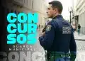 Agente da Guarda Municipal fardado de azul em rua de pedras portuguesas com a chamada "Concursos Guarda Municipal", representando o novo edital previsto em Aracaju