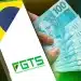 Celular exibindo logotipo do FGTS ao lado de mão segurando leque de notas de cem reais
