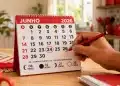 Calendário de junho de 2026 com o dia 24 circulado, destacando a data e a dúvida sobre onde é feriado.