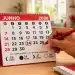 Calendário de junho de 2026 com o dia 24 circulado, destacando a data e a dúvida sobre onde é feriado.