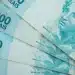 Cédulas de R$ 100 representam os pagamentos de julho do BPC/INSS para beneficiários.